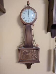 lot 36 image: General Electric Wall Clock with Colonial Relief Design, 26 Inches Tall