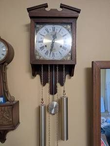 lot 37 image: Pinec Wall Clock with Pendulum and Weights, Wood Case