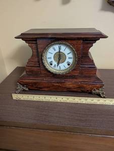 lot 62 image: Antique Wooden Mantel Clock with Roman Numeral Dial and Metal Feet