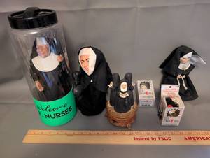 lot 82 image: Collection of Nun Figurines, Nun Dolls, and Nunzilla Windup Toys