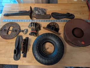 lot 327 image: Vintage Industrial Hardware Lot with Wagon Wheel, Cast Iron Pieces, and Tire