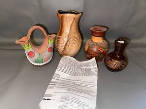lot 104 image: Collection of 4 Native American-Style Pottery Vases with Etched and Painted Designs