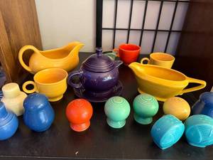 lot 112 image: Fiesta Mix Color Tableware Collection - Creamers, Teapot, Cups, Salt and Pepper Shakers
