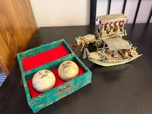 lot 121 image: Asian Decor Set with Painted Baoding Balls, Ox Cart, and Boat Figurine