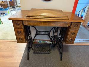 lot 297 image: Antique Singer Treadle Sewing Machine with Ornate Wood Cabinet