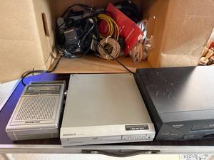 lot 342 image: Soundesign Radio, Magnavox DVD Player, Sharp VCR, and Cable Lot
