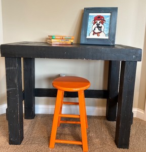 lot 107 image: Black Wooden Desk, Orange Stool, Books and Framed Bulldog Artwork Set