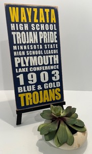 lot 79 image: Wayzata Trojans High School Wooden Sign by Ceasto Designs with Succulent Decor