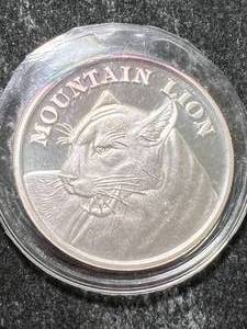 lot 28 image: 1 TROY OZ .999 FINE SILVER MOUNTAIN LION ROUND