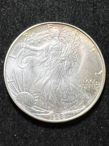 lot 54 image: 1988 AMERICAN SILVER EAGLE 1 TROY OZ .999 FINE SILVER