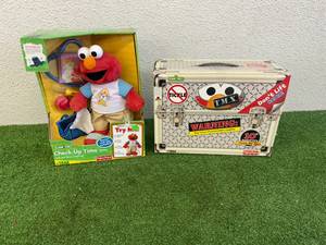 lot 23 image: Check-Up Time Elmo & T.M.X. Tickle Me Elmo