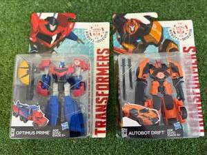 lot 234 image: Transformers Optimus Prime & Autobot Drift