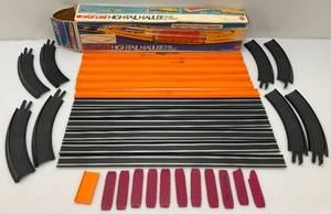 lot 8 image: 1970s Hot Line High-Tail Hauler Train & Layout (Tracks Only) In Original Box