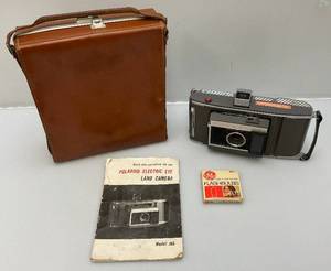 lot 36 image: Vintage Polaroid Electric Eye Land Camera J66 With Carrying Case, Manual & More
