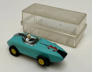 lot 68 image: 1960s-70s Aurora Indianapolis Racer Turquoise HO Slot Car  (With Original Clear Case)