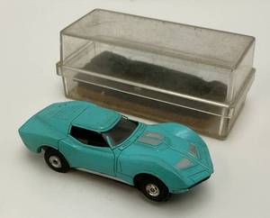 lot 69 image: 1960s-70s Aurora Mako Shark Corvette Turquoise HO Slot Car  (With Original Clear Case)