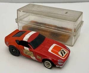 lot 70 image: 1960s-70s Aurora AFX Datsun 280Z HO Slot Car (Missing Brushes) (With Original Clear Case) Brushes Available In Lot 74