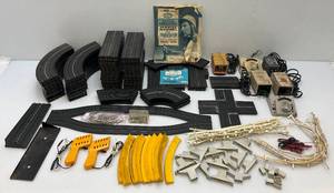 lot 76 image: Large Lot Of Misc. 1960s-70s Aurora HO Slot Car Track, Transformers, Connector Pins And More