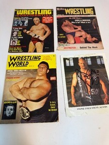 lot 75 image: Signed Photo by STONE COLD STEVE AUSTIN & Vintage Wrestling Magazines