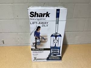 lot 35 image: Shark Navigator Lift-Away Deluxe Bagless, Cordless, Upright Vacuum Cleaner