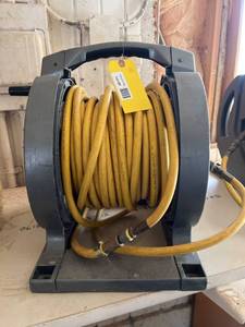 lot 69 image: Portable Hose Reel with Yellow Hose
