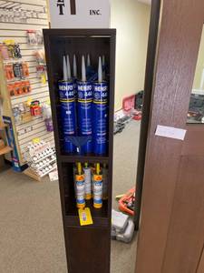 lot 122 image: Storage Shelf with Henry 440 Adhesive and Sikaflex 15 LM Sealant