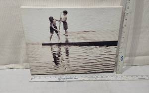 lot 21 image: Black and White Canvas Print with Children Playing on Dock