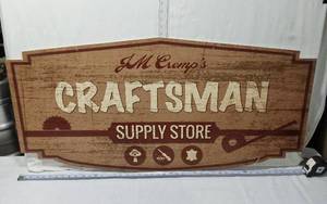 lot 22 image: JM Cremps Craftsman Supply Store Sign - Approx 22x43