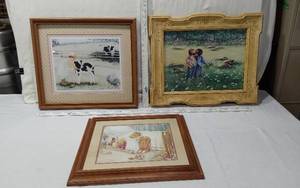 lot 39 image: Three Framed Art Prints with Charming Scenes - The first print depicts a child with a calf in a pastoral setting, the second shows two children in a field, and the third features a child with toys