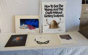 lot 69 image: Variety of Concept Art Pieces by David Moses and Portrait - One poster advertises a Vikings vs. Chiefs game - One Piece by Ned Seidler for National Geographic