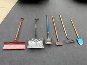lot 11 image: Set of Assorted Yard Tools Including Shovels, Rake, and Snow Pusher
