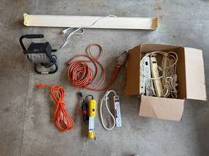lot 31 image: Lot of Power Strips, Extension Cords, Work Lights, Black & Decker Drill, and Gloves