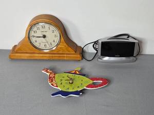 lot 45 image: Mantel Clock, Sharp Alarm Clock, and Teapot Wall Clock Lot