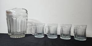 lot 82 image: Glass Water Pitcher with 4 Matching Ribbed Glasses Set
