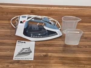 lot 173 image: BlackDecker Steam Iron with Water Cups and Shark Owners Guide
