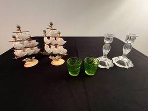 lot 197 image: Collection of 2 Shell Ship Figurines, 2 Green Glass Votive Holders, and 2 Glass Candle Holders