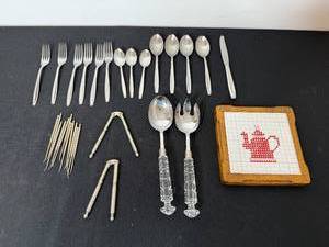 lot 276 image: Assorted Flatware Inc International Stainless and Serving Utensils with Decorative Tile Coaster
