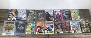 lot 215 image: Lot of 16 Comic Books and 1 YU-GI-OH Collector Becket