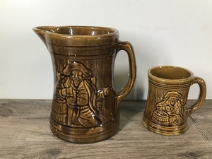 lot 314 image: Vintage McCoy Stoneware Pirate Beer Pitcher with Matching Mug