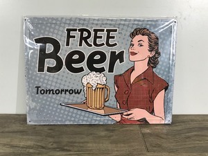 lot 346 image: Metal Sign Still Wrapped in Plastic - Free Beer Tomorrow