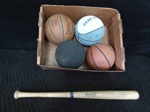 lot 59 image: 4 basketballs and a wood bat