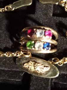 lot 33 image: 10k ring with stones and a black hills gold bracelet