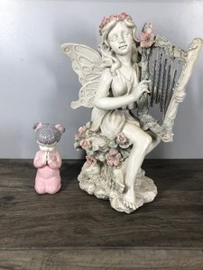 lot 361 image: Little Girl Praying and a Fairy with Wind Chimes