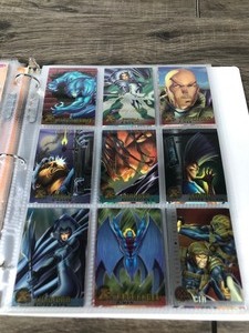 lot 387 image: Lot of 205 Collectible Trading Cards - 1992 MAD Magazine Cards - Black and White Cards of Historical Markers - 1992 Elvis Cards - 1991 Terminator Cards - 1995 Marvel Cards - Rocketeer Cards