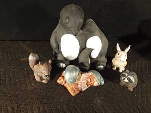 lot 143 image: Cement penguin and resin rabbit, racoon, & squirrel and ceramic gnome