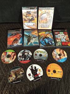 lot 131 image: 5 PS2 games without cases and 5 empty PS2 cases, 1 PS4 game and 1 Xbox game