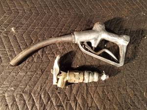 lot 125 image: Vintage gasoline pump nozzle and a barrel tap