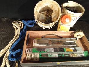 lot 69 image: 2 buckets of fence post clips, new lawn mower blades, horse lead rope, tow rope, hand tire pump, strap, weed wacker string