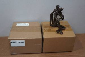 lot 74 image: 2 Dayna B. Cast Iron Sculpture - Child Embracing Father