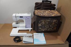 lot 10A image: Brother XR1300 Computerized Sewing Machine with Accessories and Trolley Case